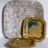 Set of three potter's plates in enamelled earth