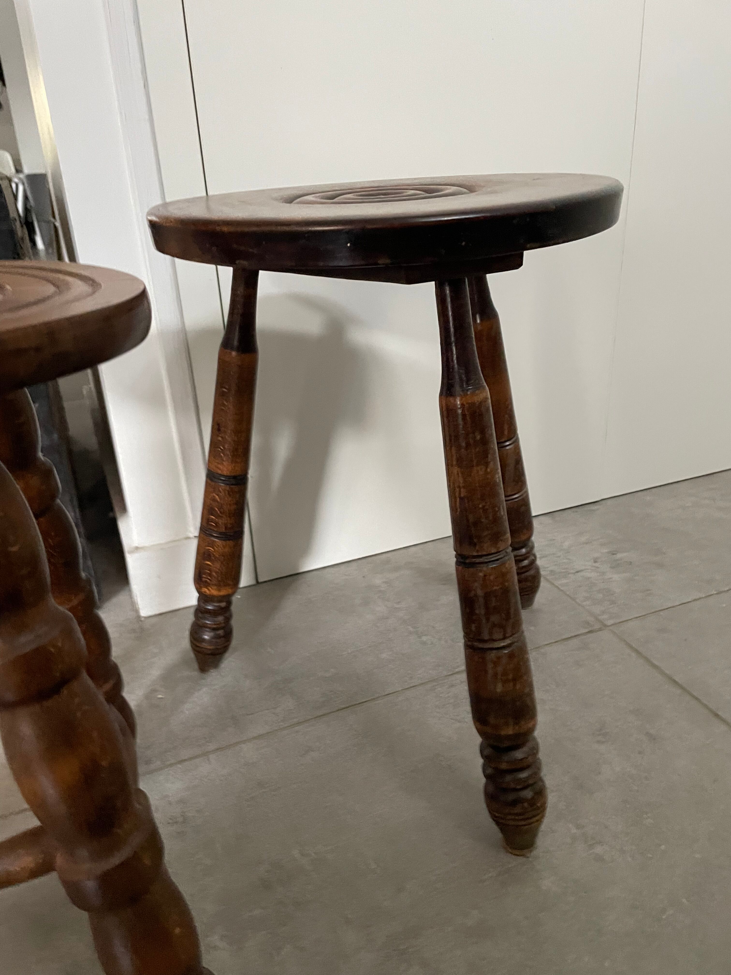 Set of two tripod stools in turned wood