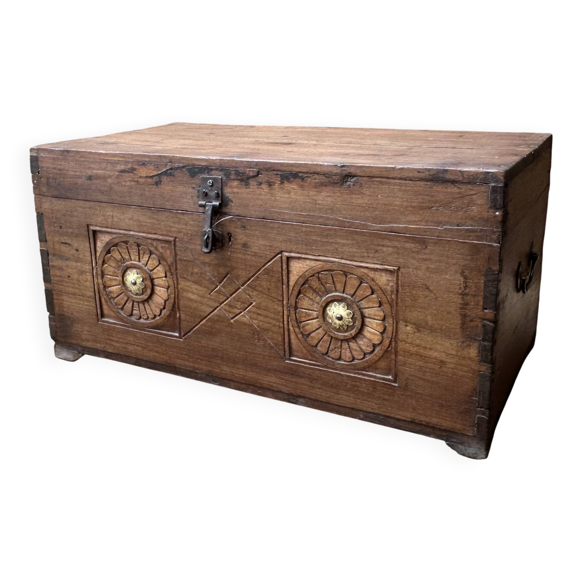 Teak chest from Burma with carved rosettes.