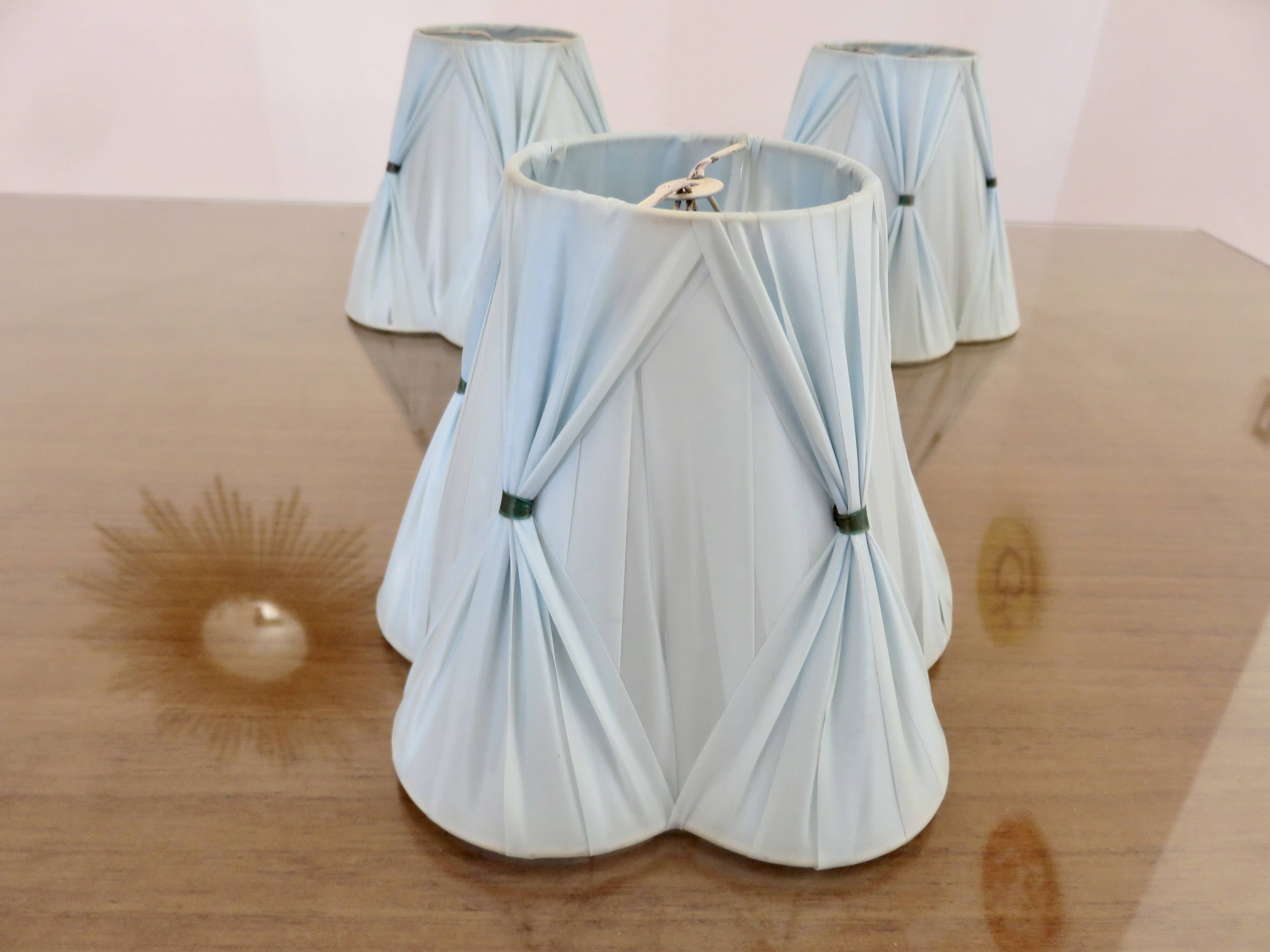 Set of 3 pale blue plastic strip lampshades, to clip onto a bulb.