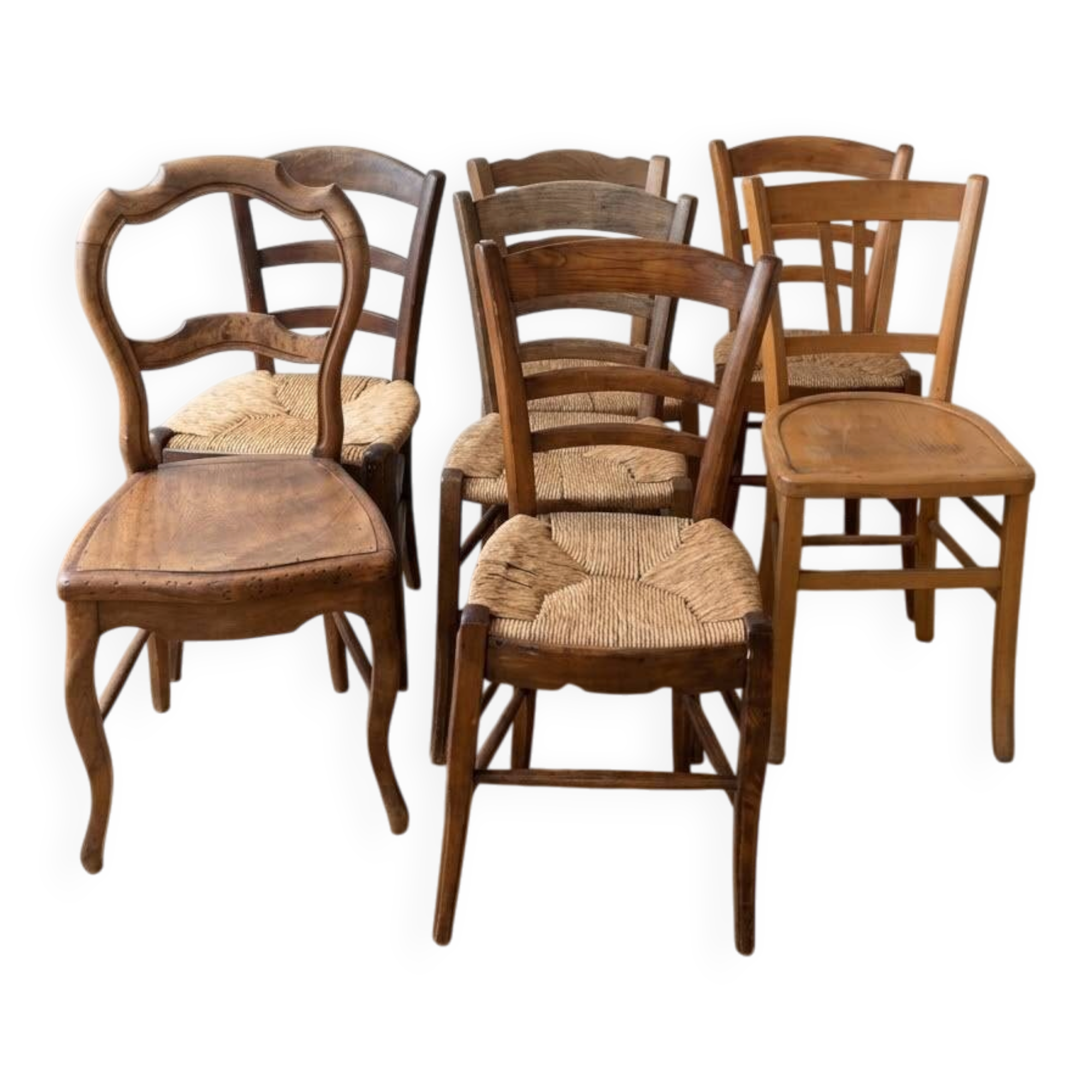 Set of 7 antique wooden and straw chairs.