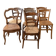 Set of 7 antique wooden and straw chairs.