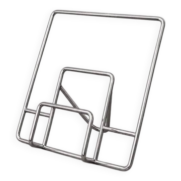 Vintage chrome tubular display stand for vinyl records or magazines.