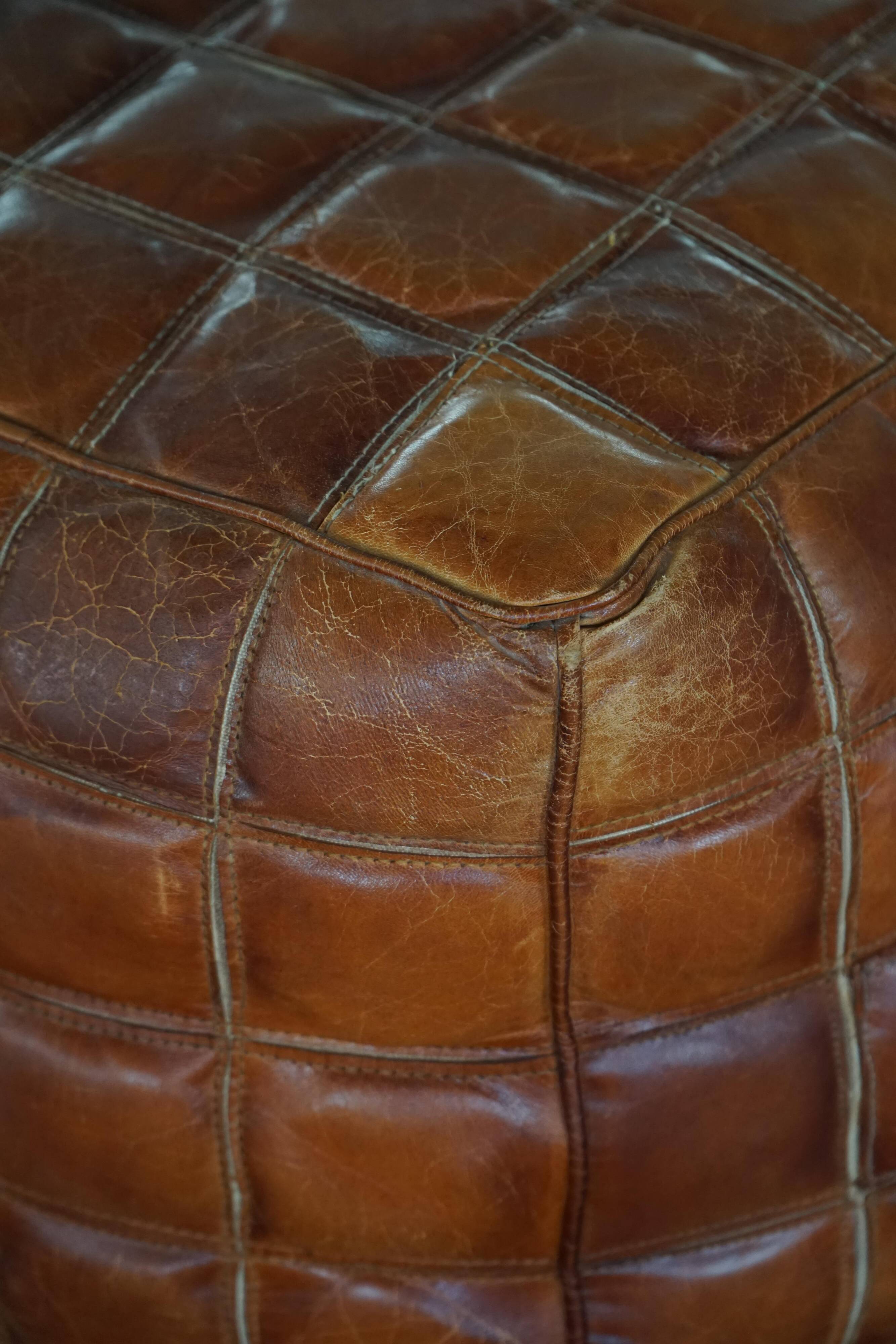 Mid-20th century pouf / ottoman cube in patinated brown leather, 1960s.