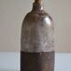Ceramic bottle vase with a fish signature to be identified.