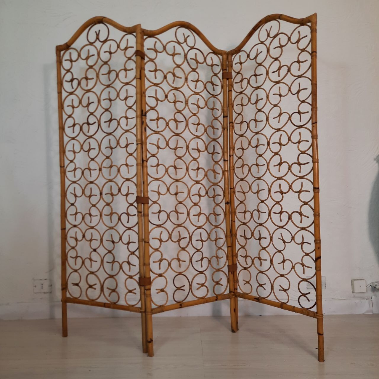 Vintage screen made of bamboo, wicker and leather