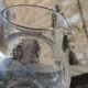 Vintage blown glass pitcher with bubbles, transparent.