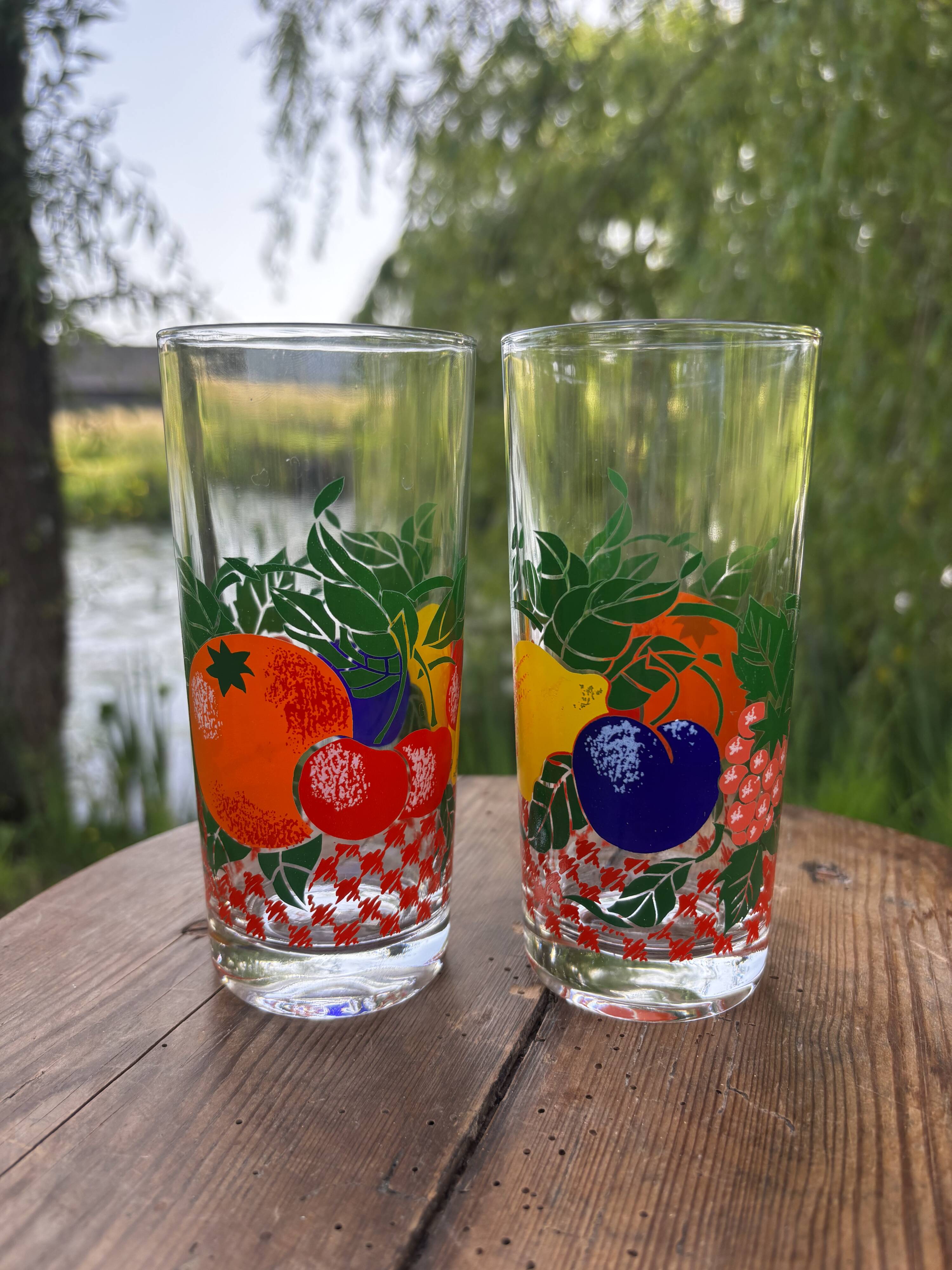 Vintage set of 4 fruit-decorated orangeade glasses.