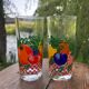 Vintage set of 4 fruit-decorated orangeade glasses.