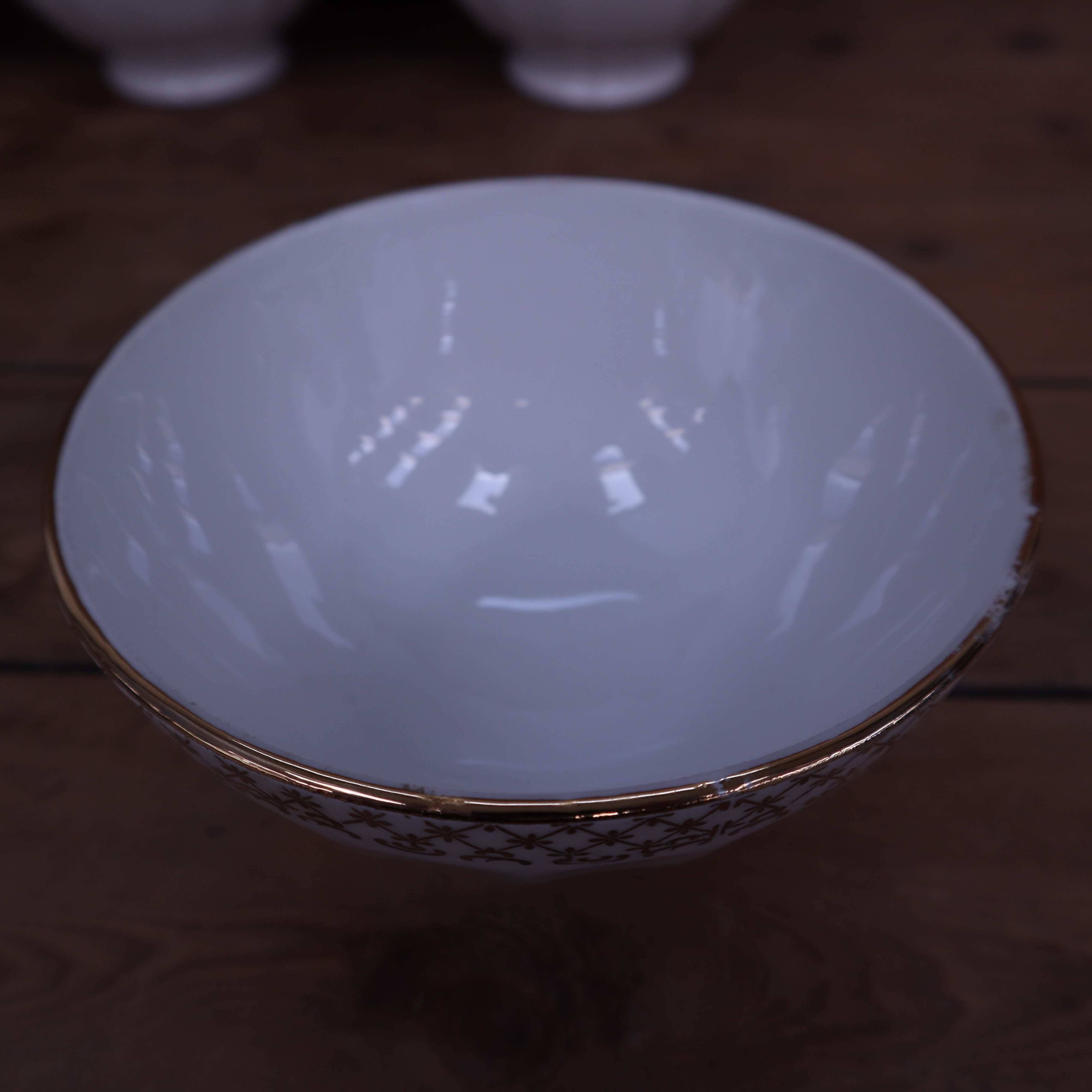 Antique white ribbed porcelain bowl with gold frieze