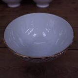 Ancien bol en porcelaine côtelé blanc avec frise dorée