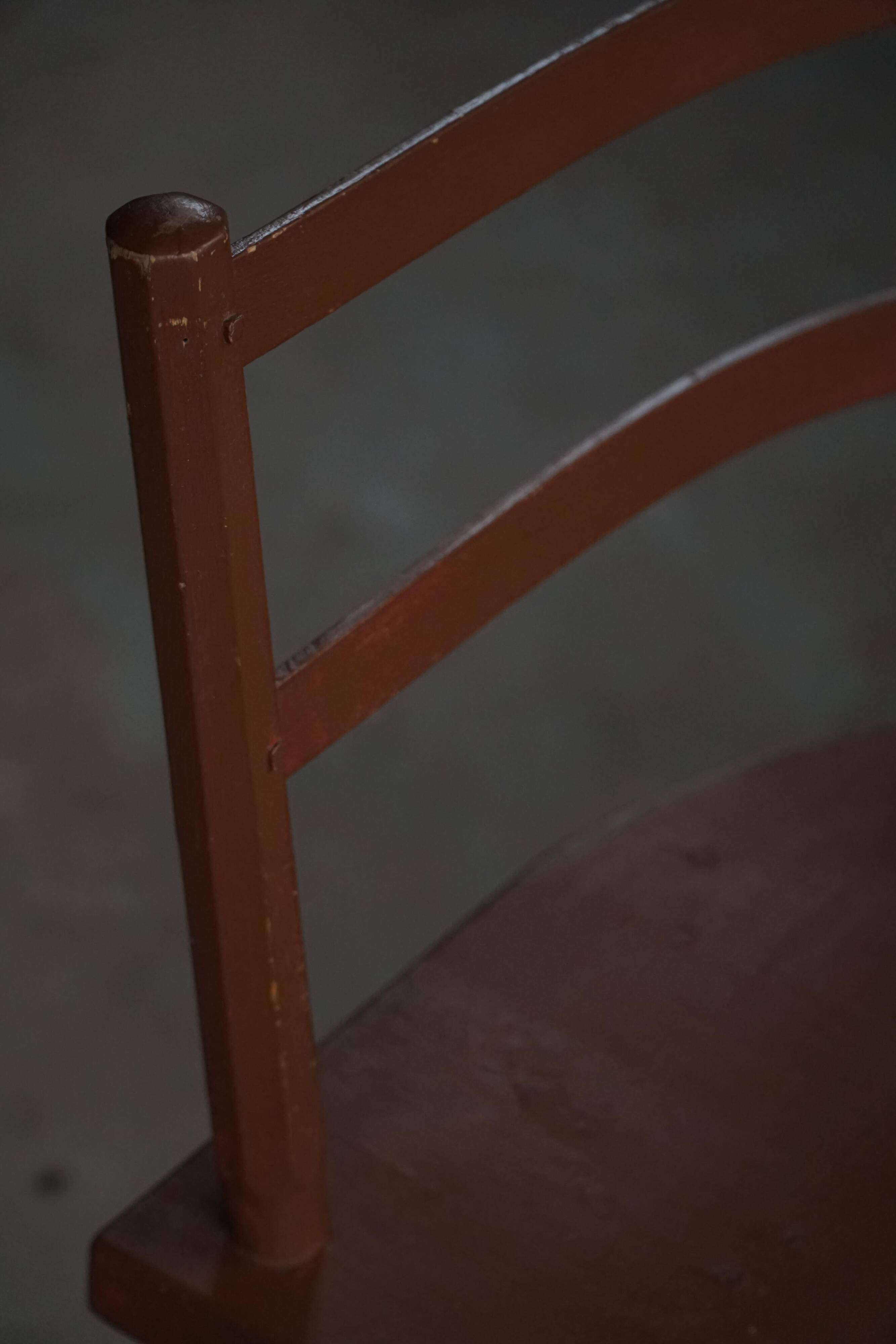 Pair of Scandinavian wooden armchairs with hand-carved folk motifs, 1920s.