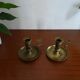 Pair of vintage brass pusher candle holders