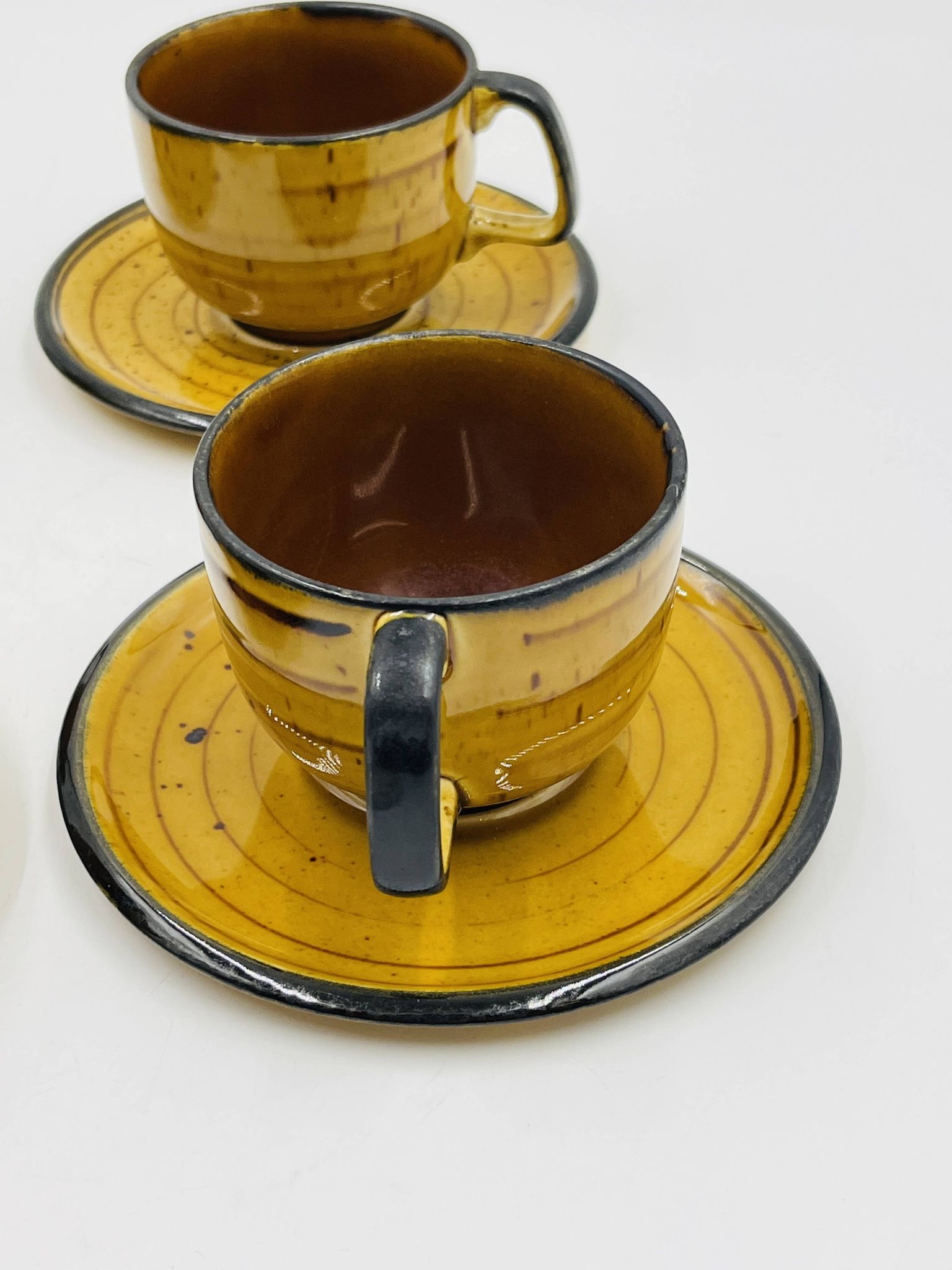 Set of four vintage Boch Palma cups and saucers.