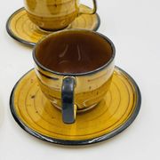 Set of four vintage Boch Palma cups and saucers.