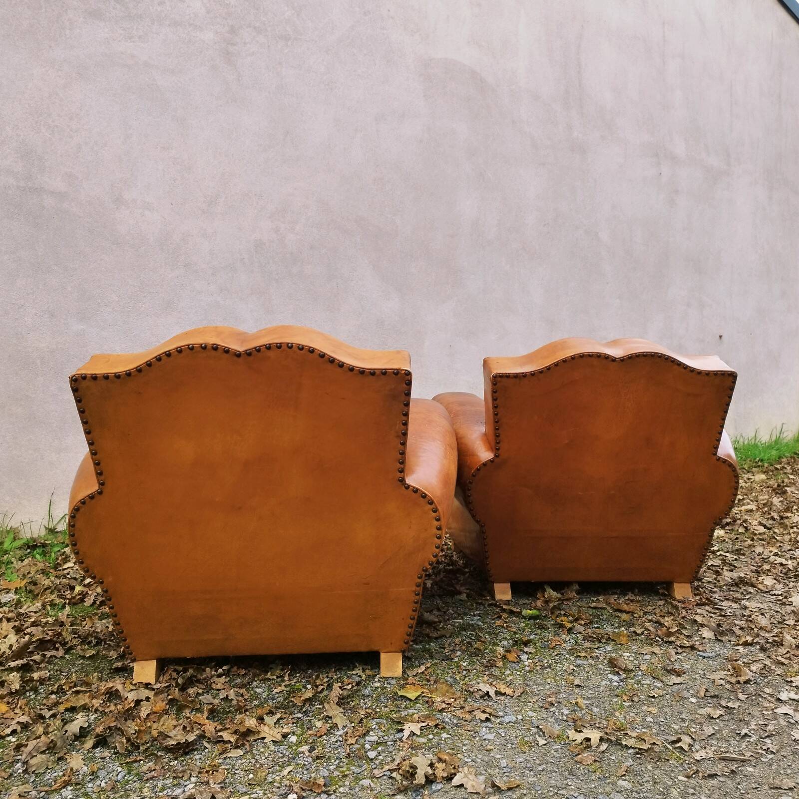 Paire de fauteuils club Moustache vintage cuir fauve
