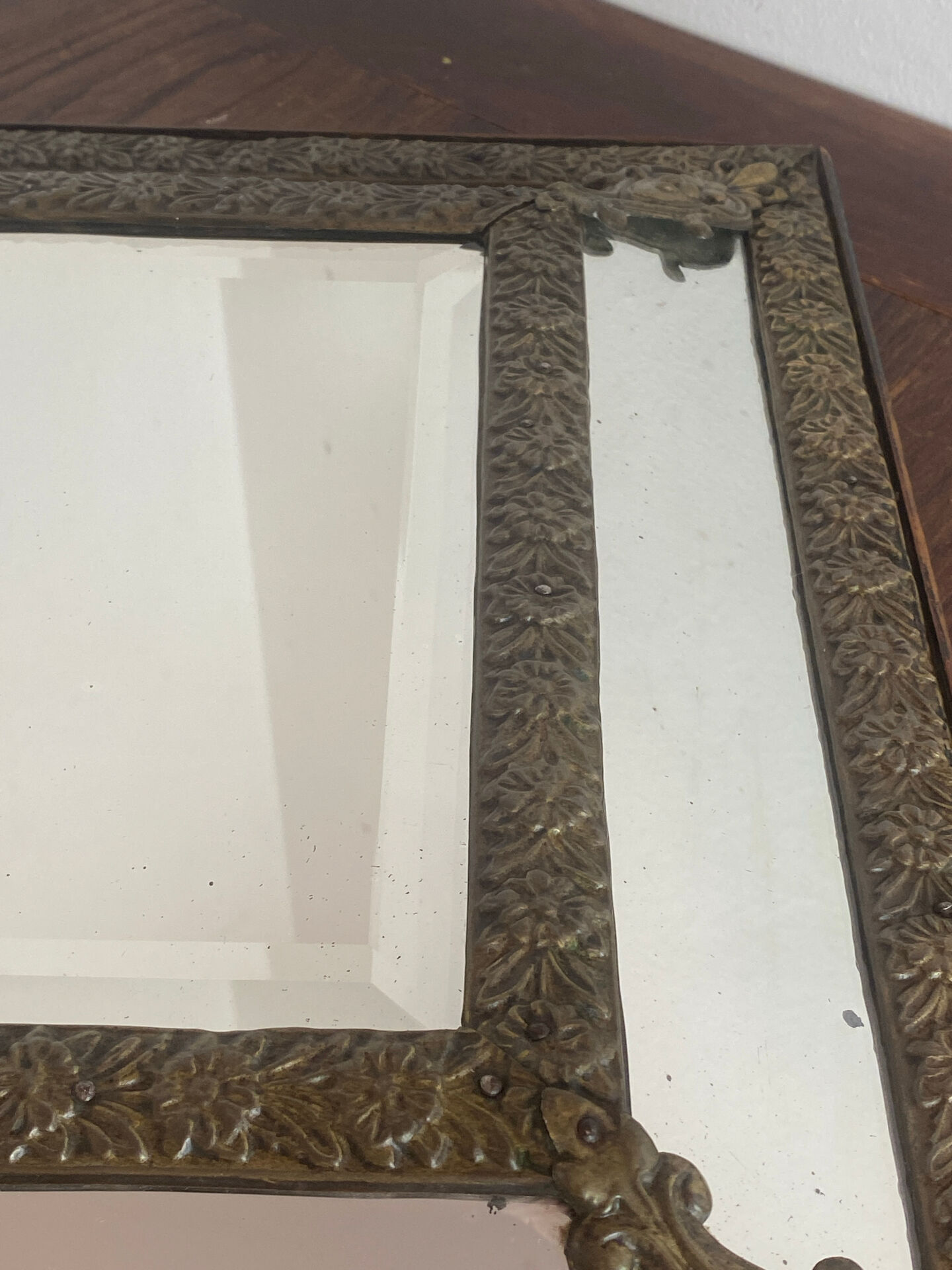 Mirror with brass repoussé frame