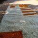Handmade orange and white wool rug, traditionally crafted, size 140 x 260 cm