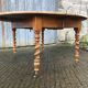Round table in solid cherry wood, extendable with twisted legs, Louis Philippe style.