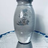 Handcrafted gray stoneware vase with child illustration