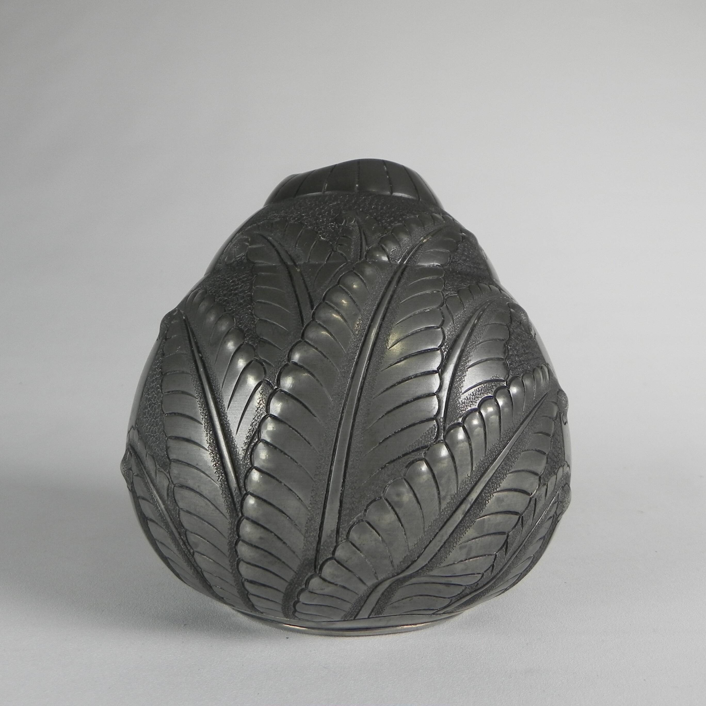 Art Nouveau pewter vase, signed PETIZON, early 20th century.