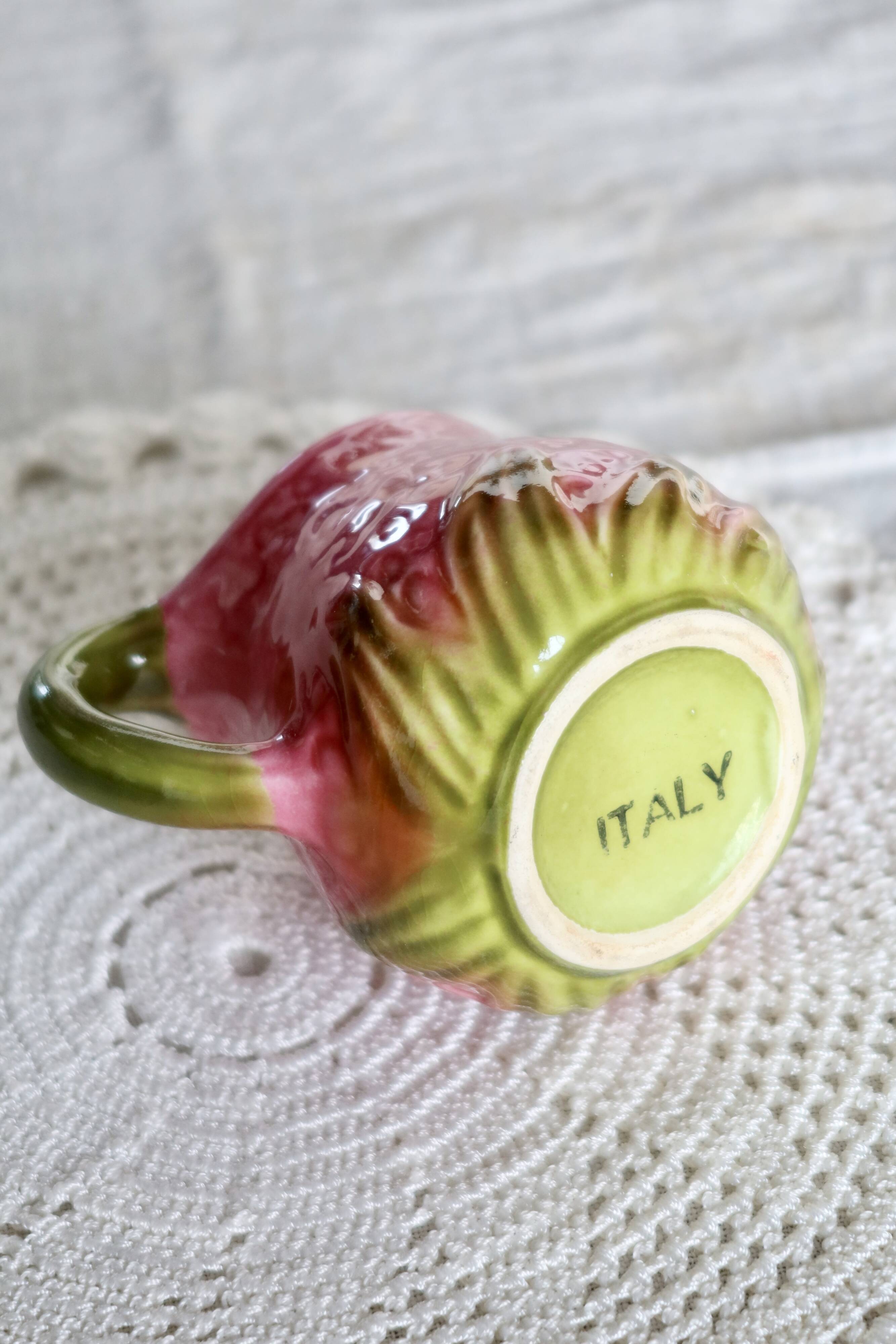 Vintage milk jug in Italian faience majolica.