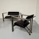 Brutalist living room with faux metal armchairs designed by Karl Friedrich Forster