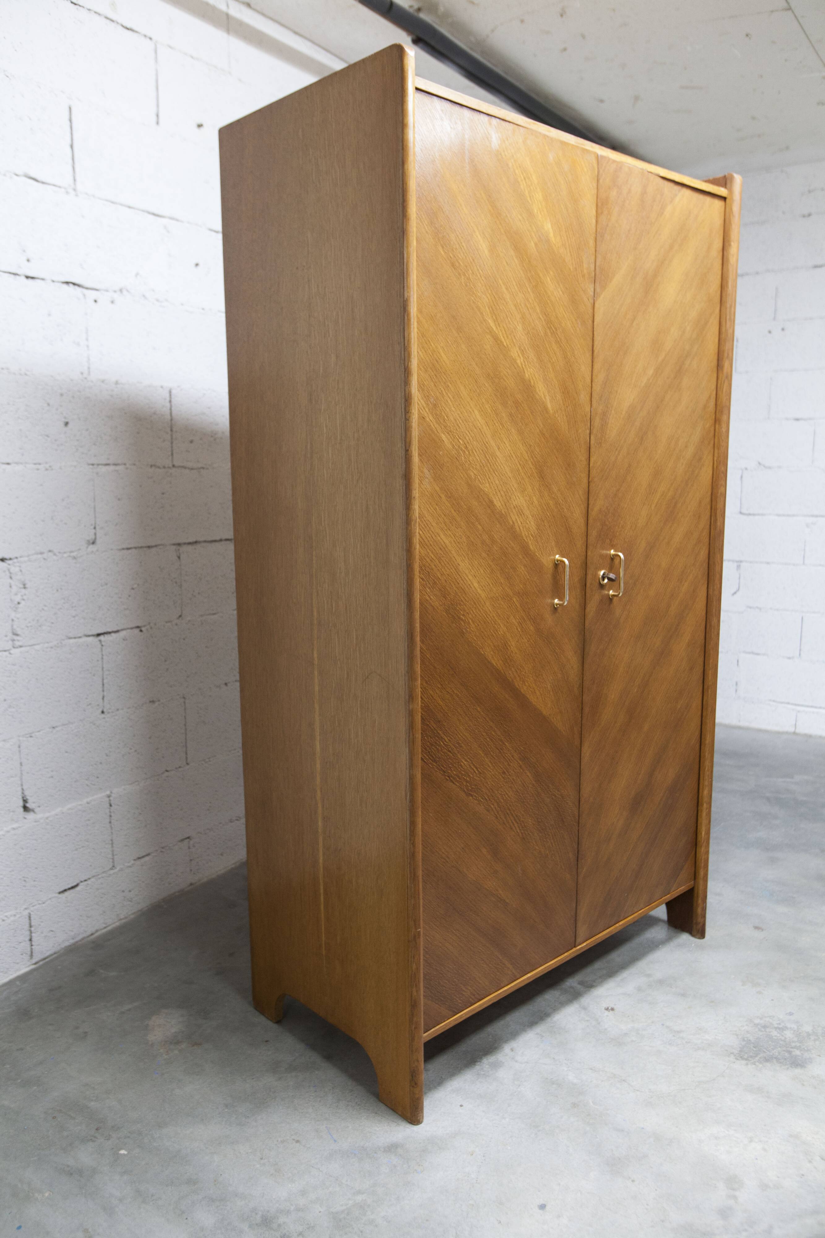 1950s Mid-Century Modern oak armoire with two doors and two drawers.