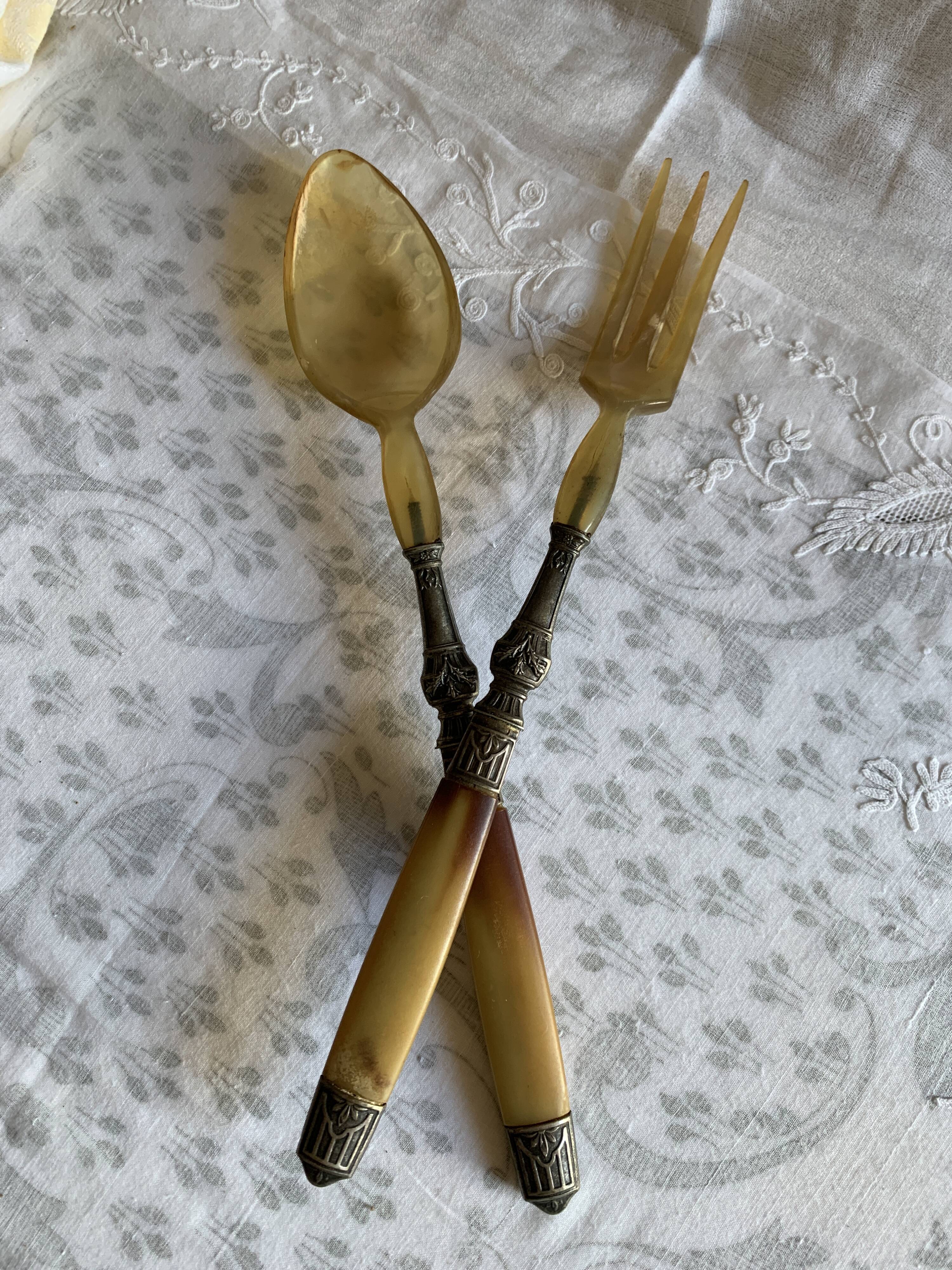 Horn and metal salad servers from the 1920s