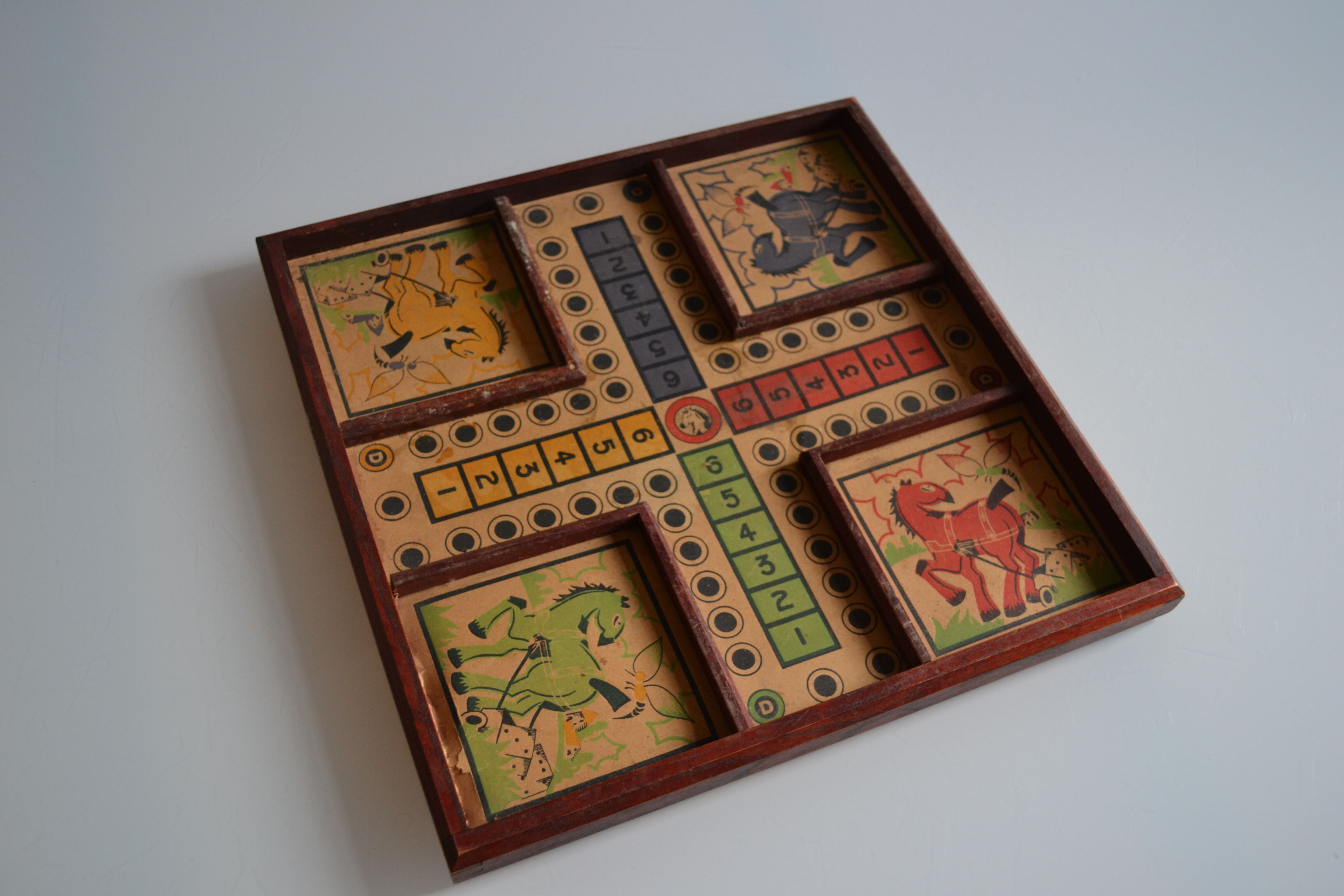 Old game board of small horses
