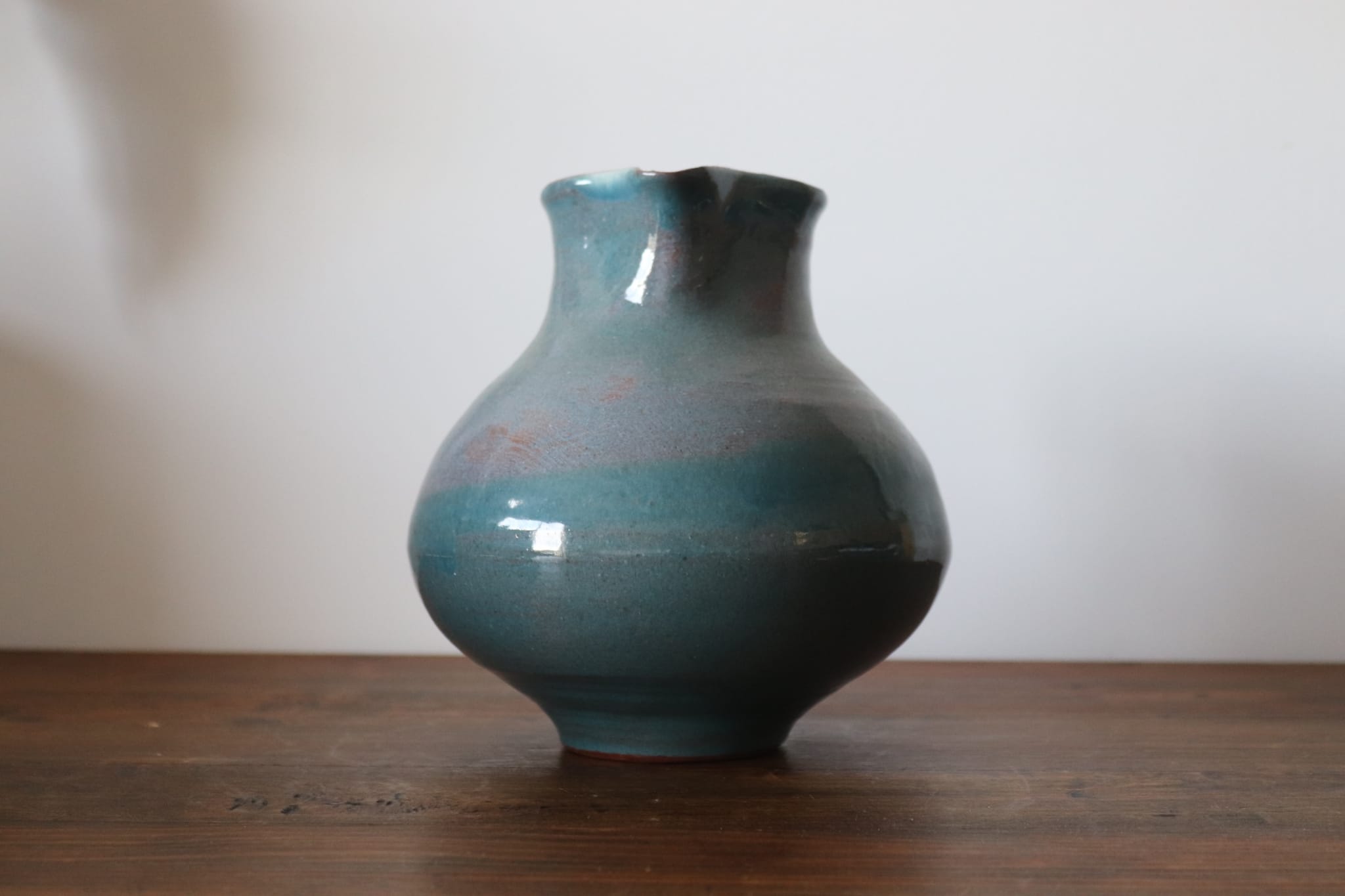 Varnished blue terracotta pitcher