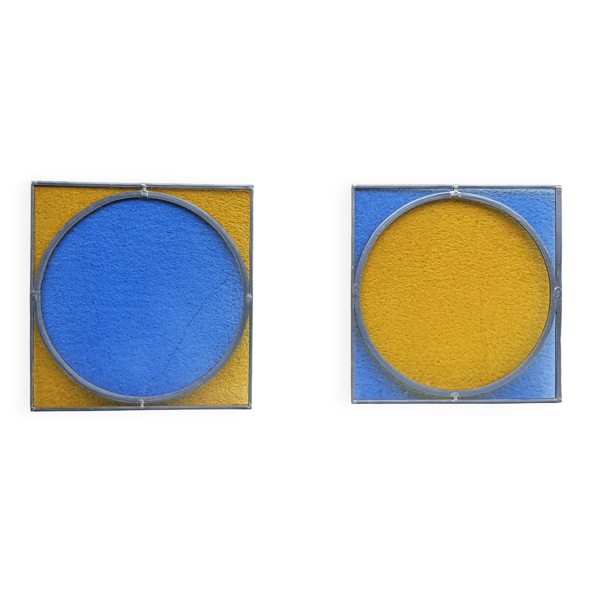 Pair of antique blue and yellow stained glass windows