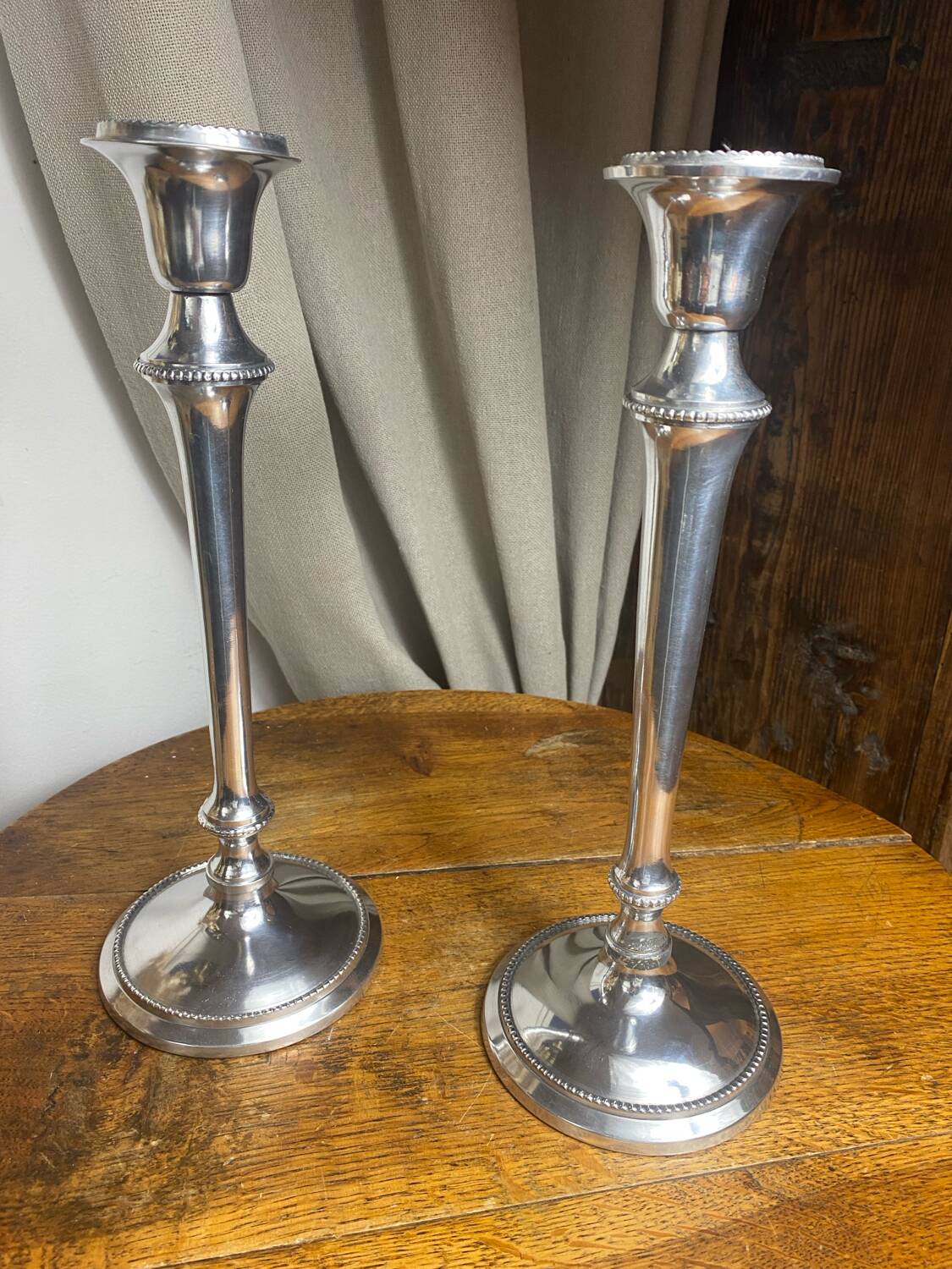 Pair of silver-plated metal candlesticks