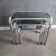 3 Vintage trundle tables in chromed steel and smoked glass