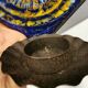 Wall-mounted candle holder in cast iron and ceramic. Estimated Danish and from the 70s.