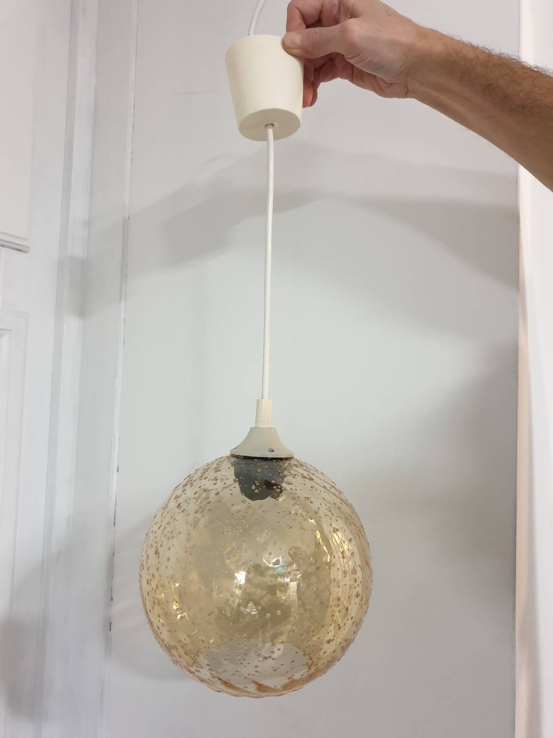 Vintage globe pendant in amber bubble glass