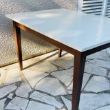 Vintage oak farmhouse table with a white top.