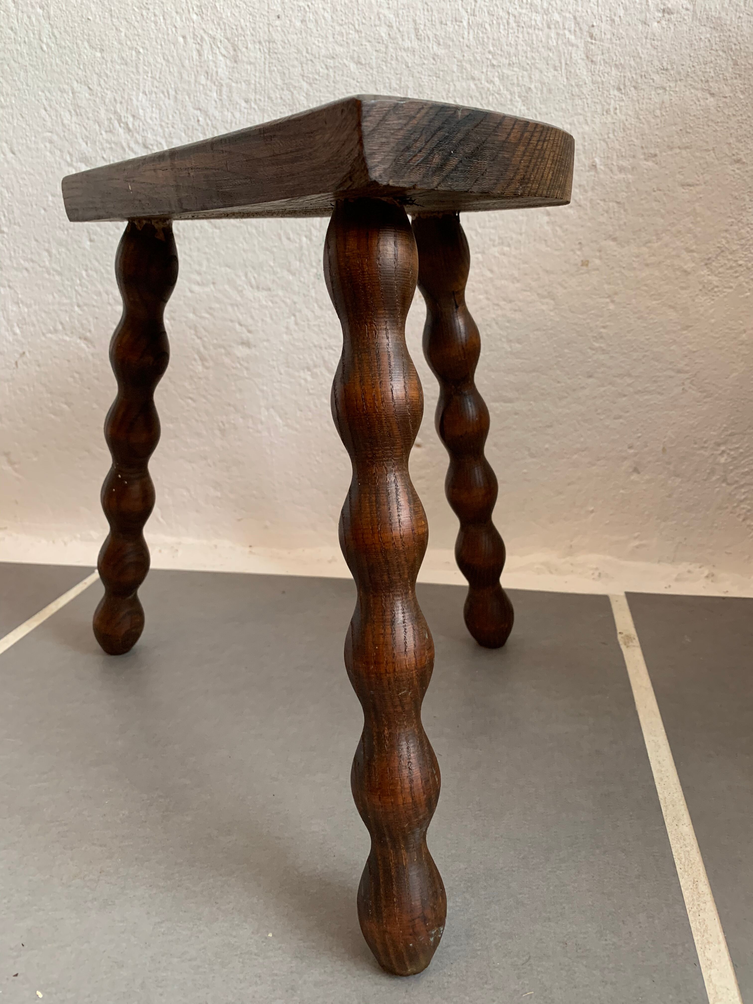Old wood tripod farm stool