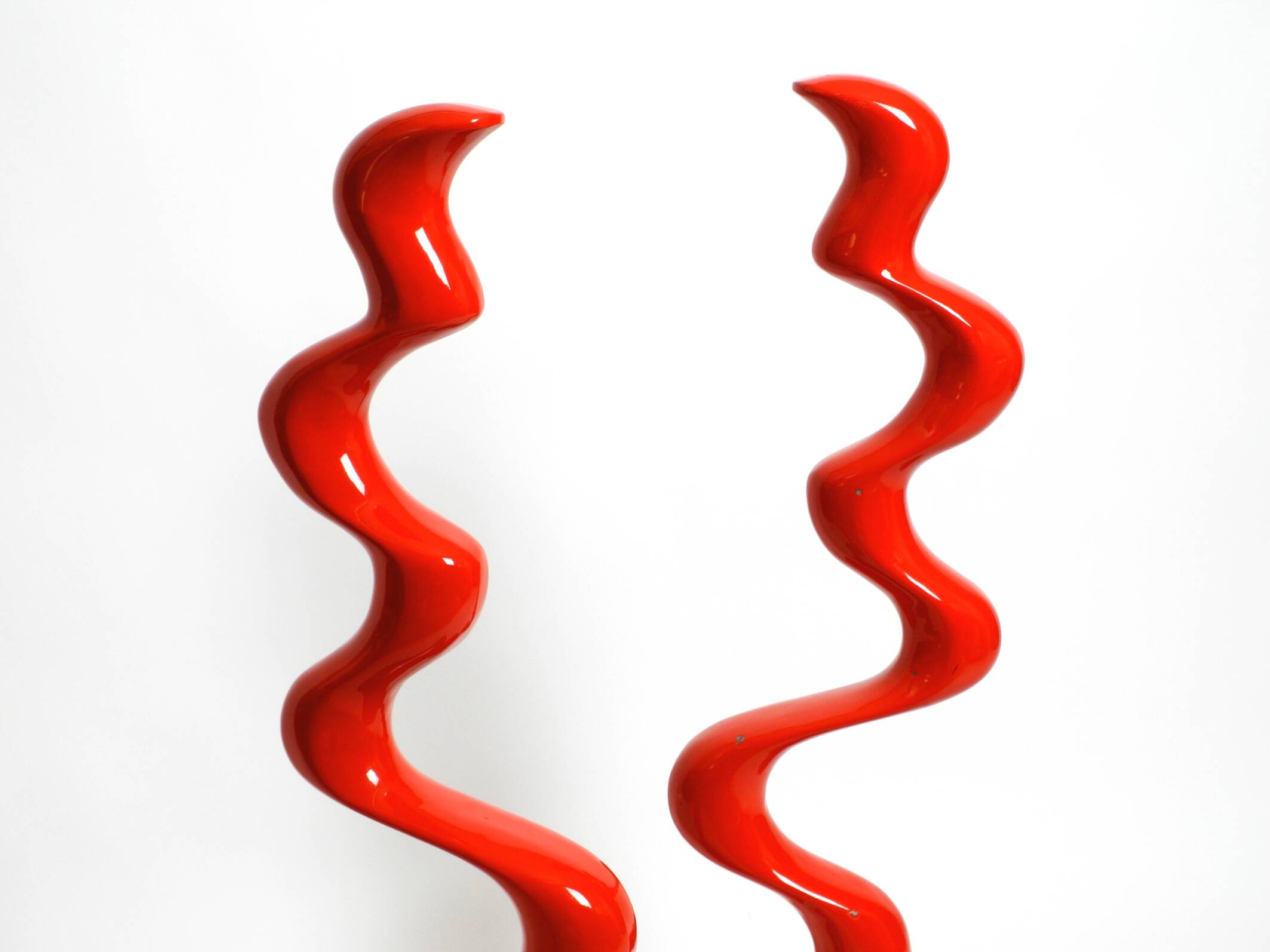 Two large limited abstract metal floor sculptures in red