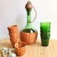 Service carafe and vintage glasses, with wicker