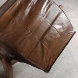 Armchairs in leather and vintage wood 70's