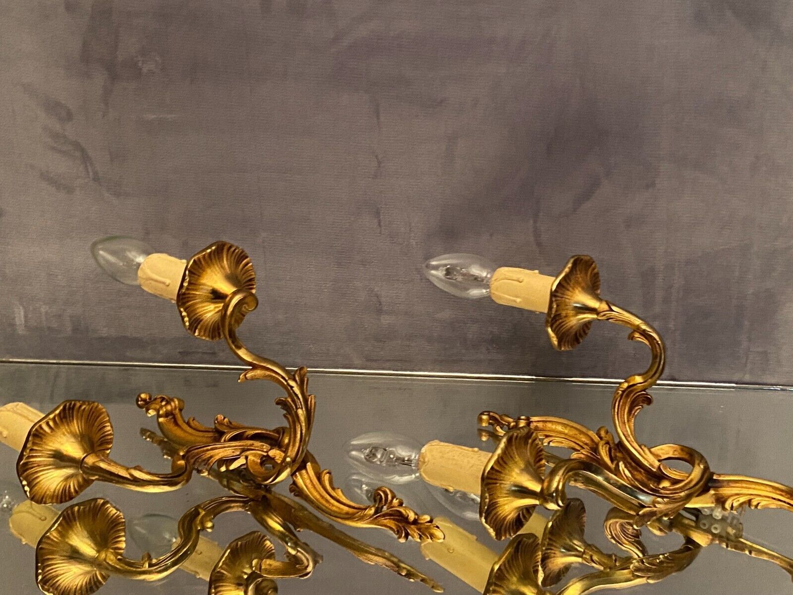 Pair of Louis XV style gilded bronze sconces