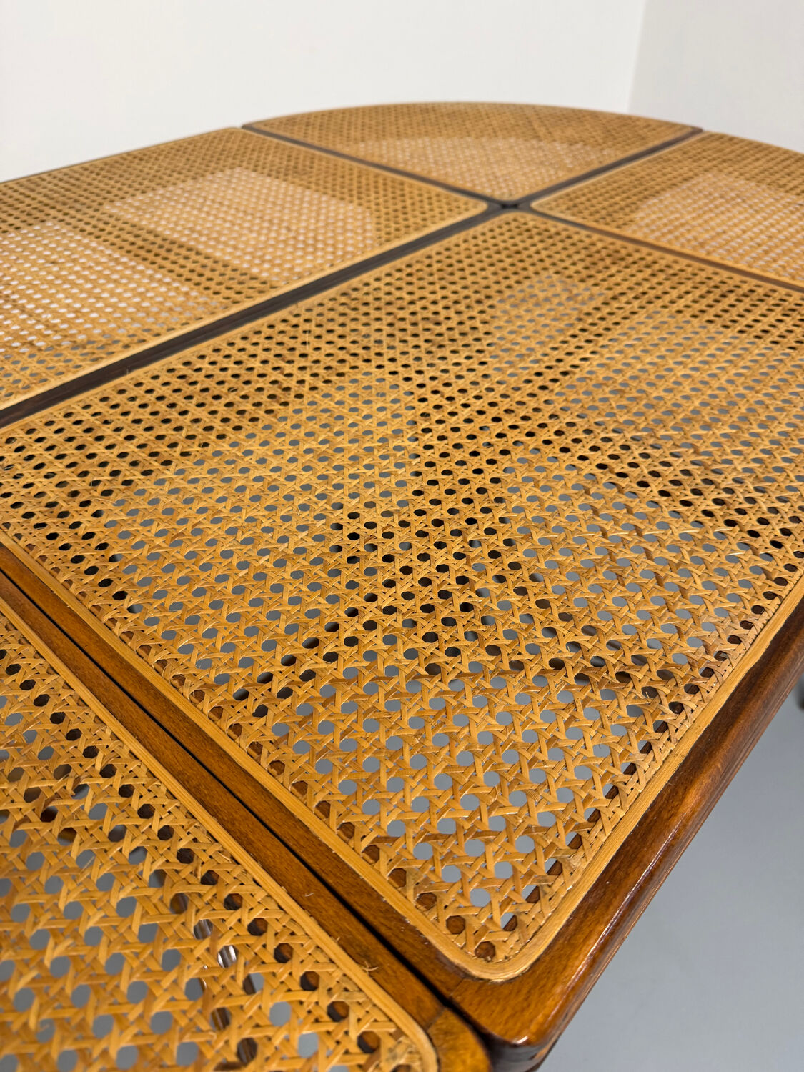 Vintage dining table with a cane top by Mundus from the 1970s.