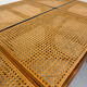 Vintage dining table with a cane top by Mundus from the 1970s.