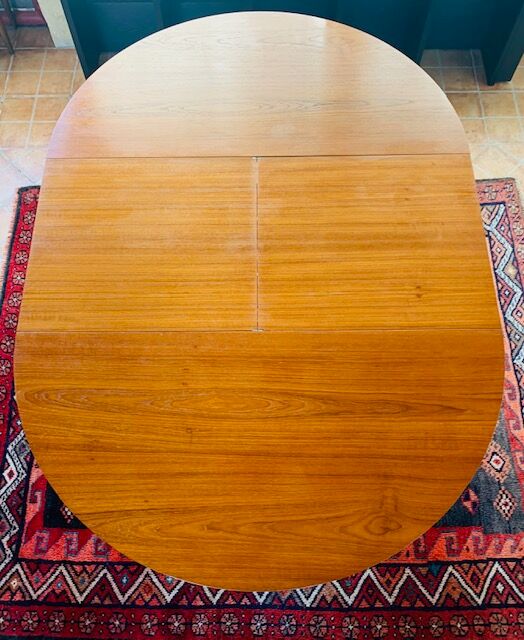 Expandable teak dining table, butterfly extension, circa 60s