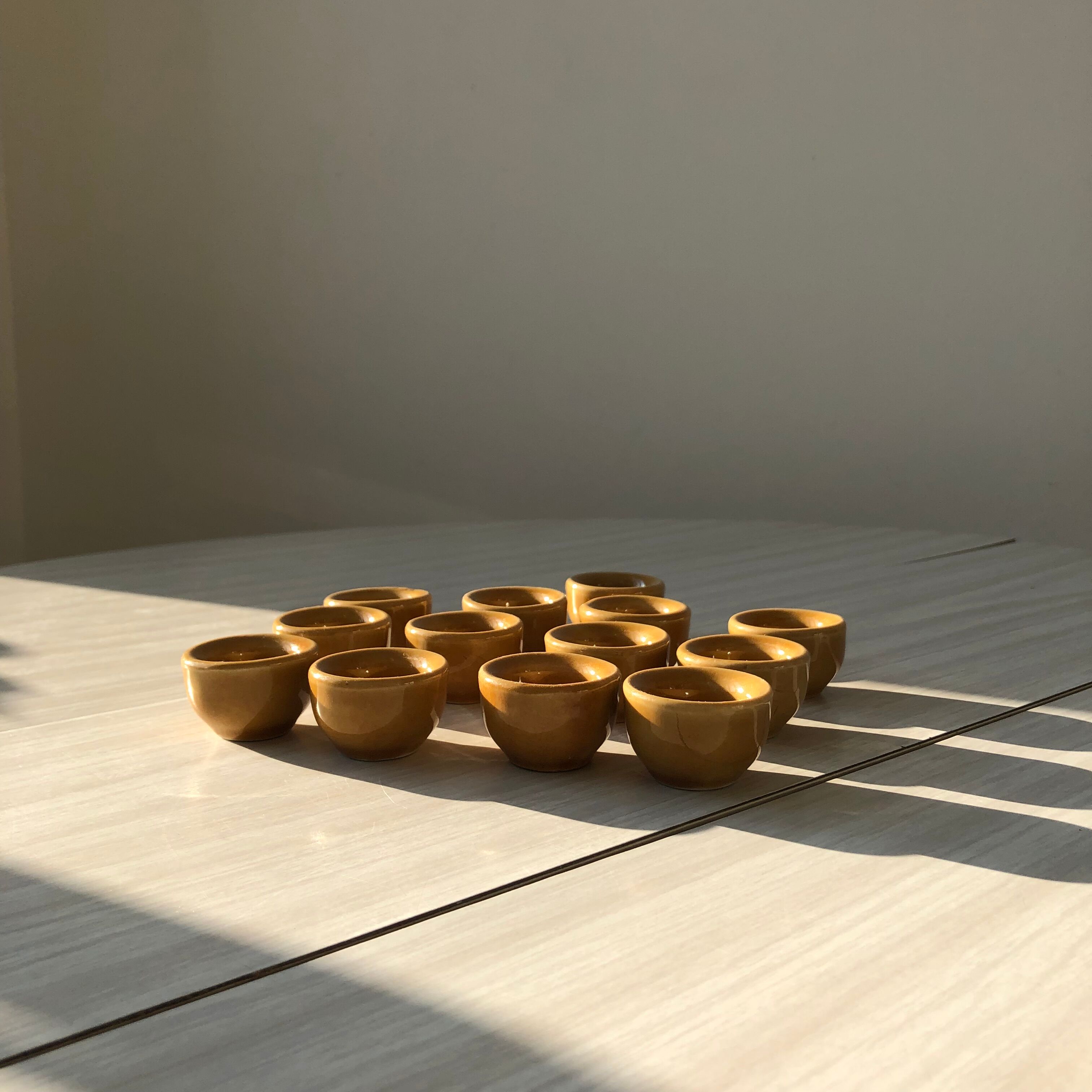 13 snail buckets or eggcups in fire porcelain glazed yellow-brown color
