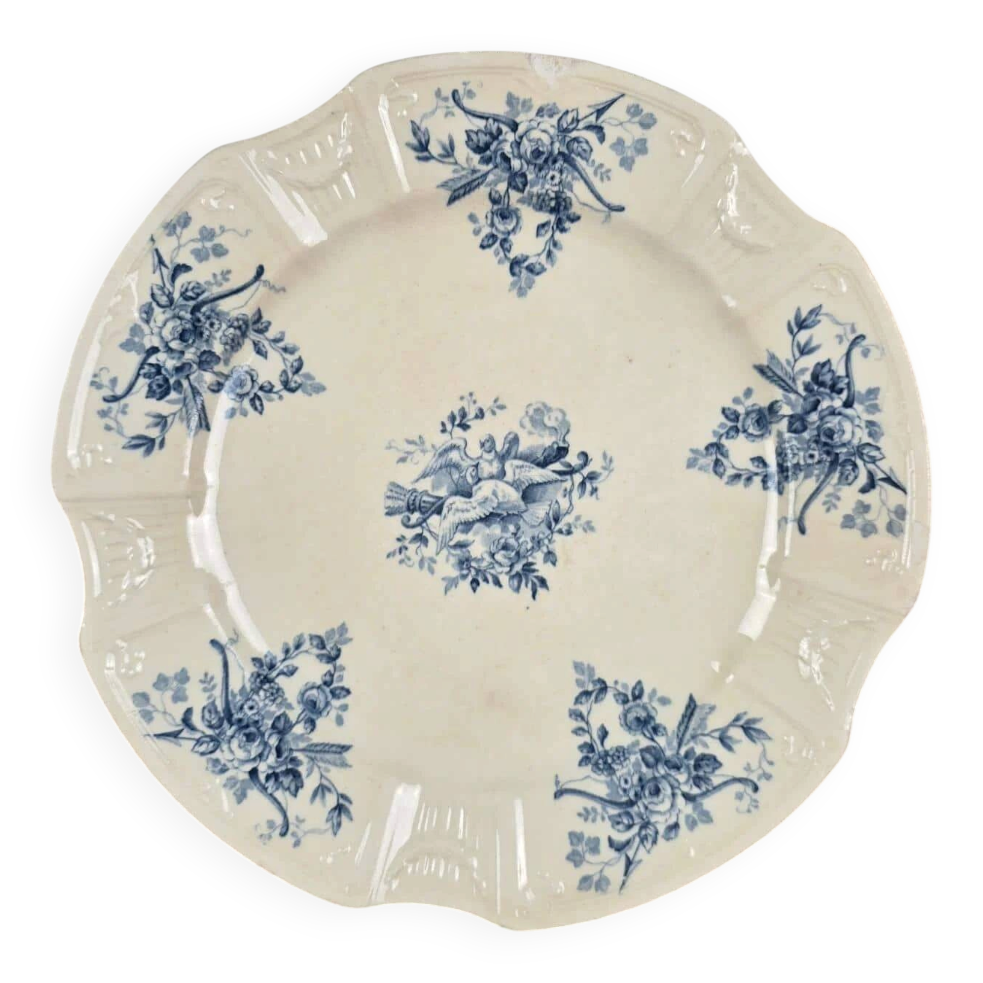 Old Gien plate with carved edges featuring doves and blue flowers, circa 1920-1930.