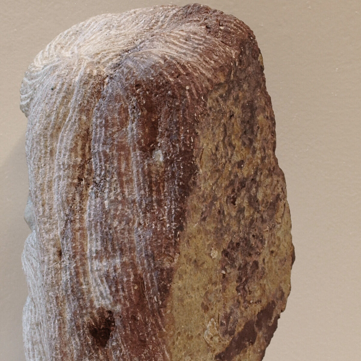 Carved stone head sculpture