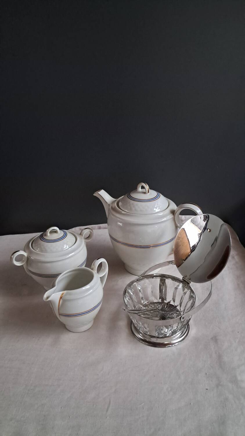 Teapot, sugar bowl, milk jug, jam jar.