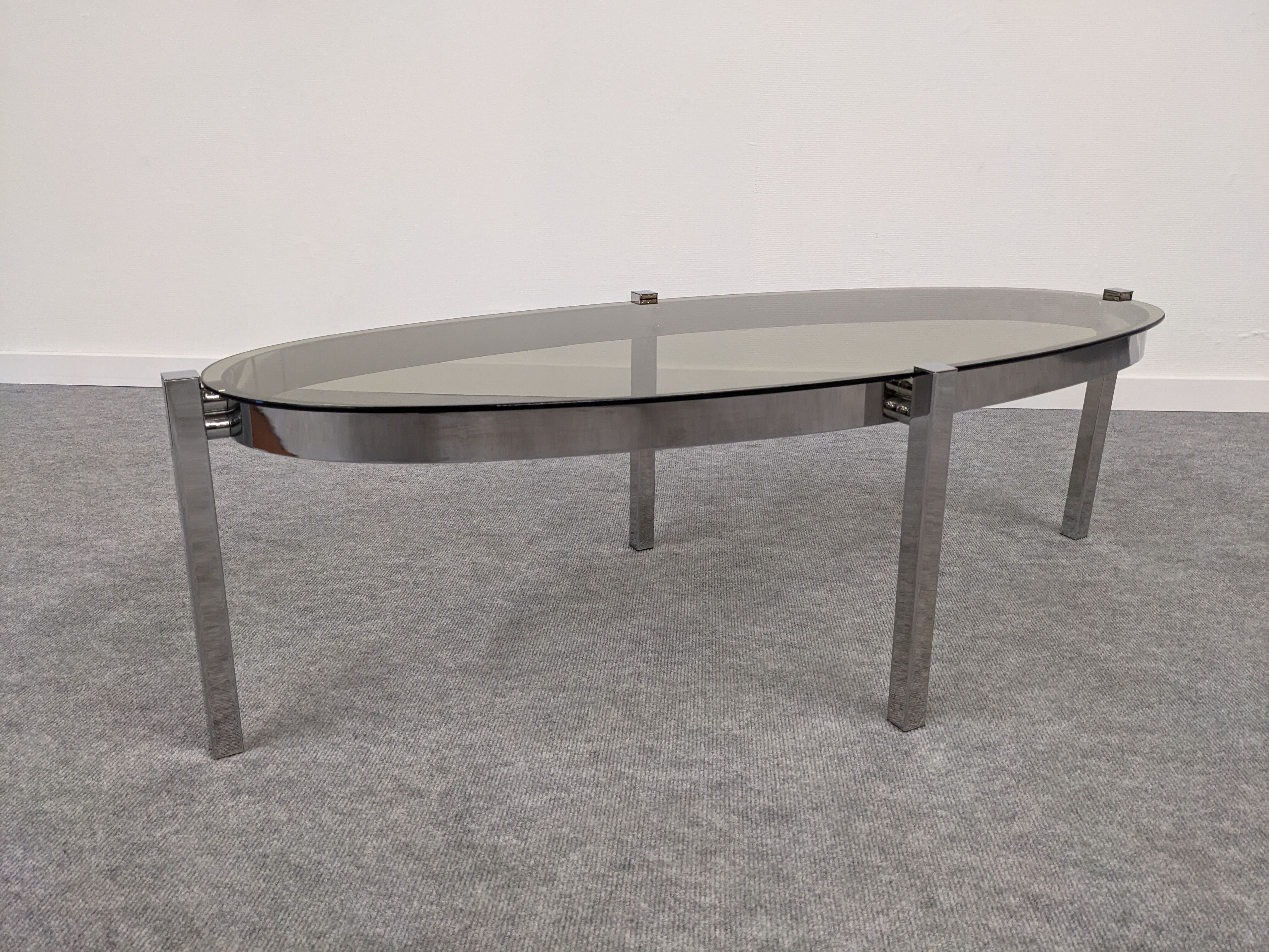 Oval smoked glass coffee table from the 60s/70s